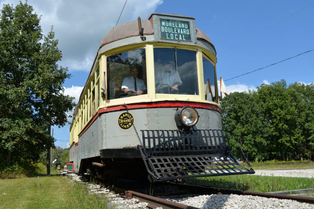 Visitors boarding a restored historic trolley car at Northern Ohio Railway Museum.